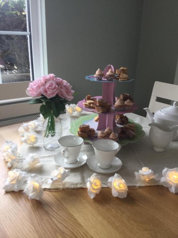 Tea and cake served at a table at Crookedstone House
